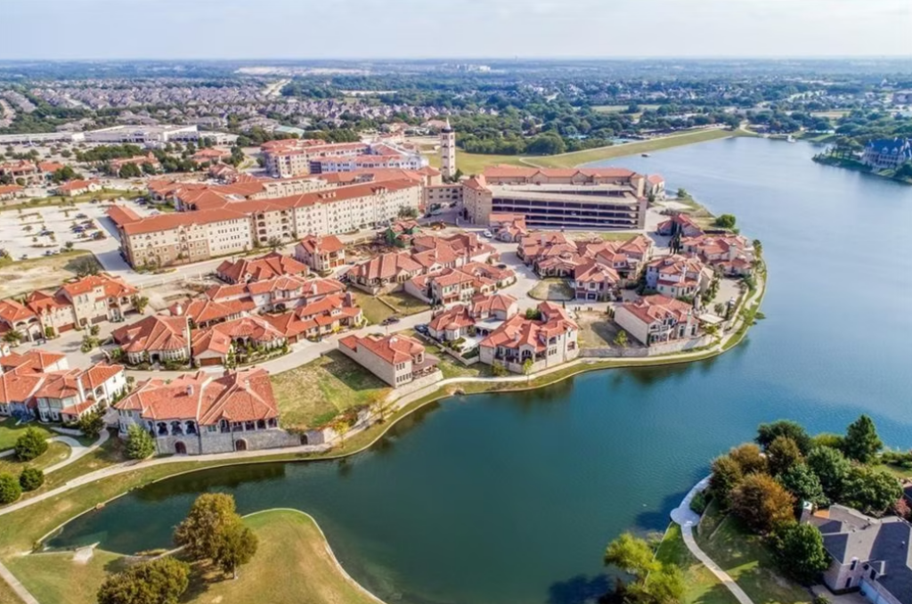Aerial view of Bella Donna Chapel in McKinney, Texas, highlighting the chapel’s picturesque setting surrounded by landscaped grounds, nearby buildings, and the peaceful North Texas landscape.