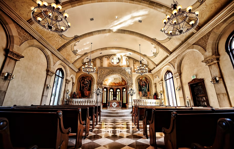 Interior view of Bella Donna Chapel in McKinney, Texas, showcasing a romantic and intimate ceremony space with elegant architectural details, soft natural light, and a serene atmosphere for weddings.