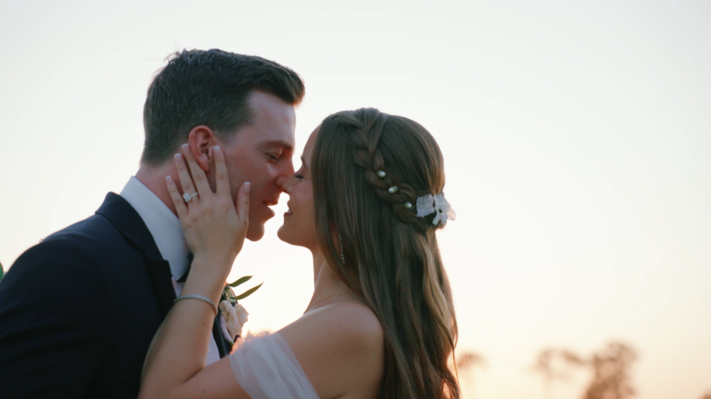 Bride and groom sharing a kiss during their wedding day in Dallas, Texas, captured in a romantic moment celebrating their newlywed joy.