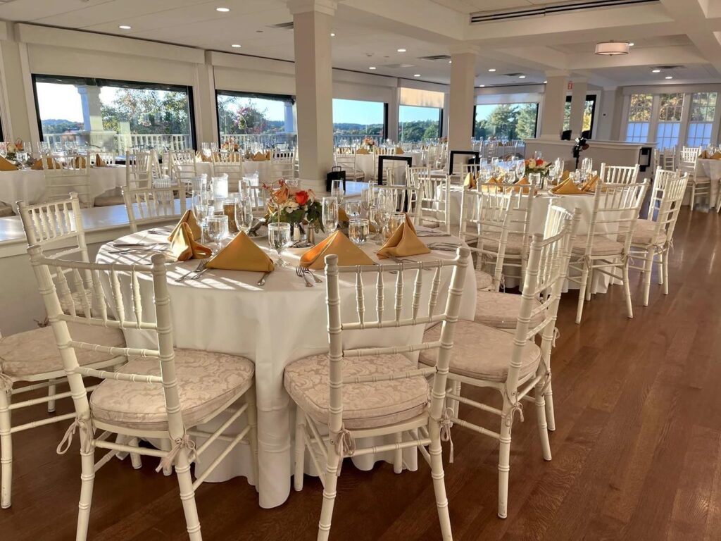 Indoor wedding reception at Bellevue Golf Club with guest tables and elegant event design.