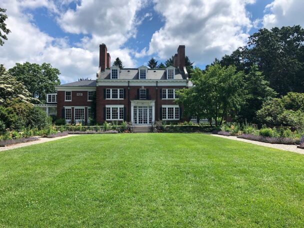 Exterior of The Bradley Estate in Massachusetts featuring historic mansion and formal gardens.