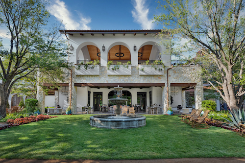 Exterior view of Hotel Drover in Fort Worth, Texas, showcasing its rustic luxury design, warm architectural details, and welcoming Western-inspired entrance.