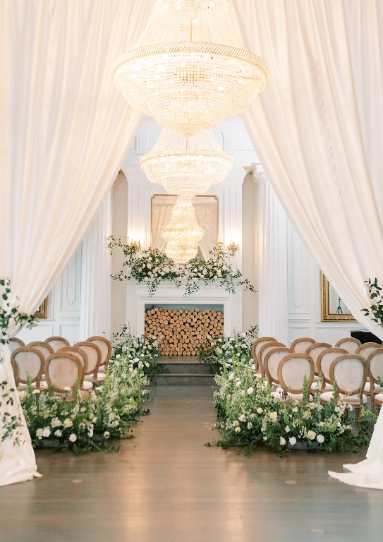 Interior wedding ceremony at The Mason in Dallas, Texas, featuring a modern industrial space with exposed brick, high ceilings, and warm ambient lighting.